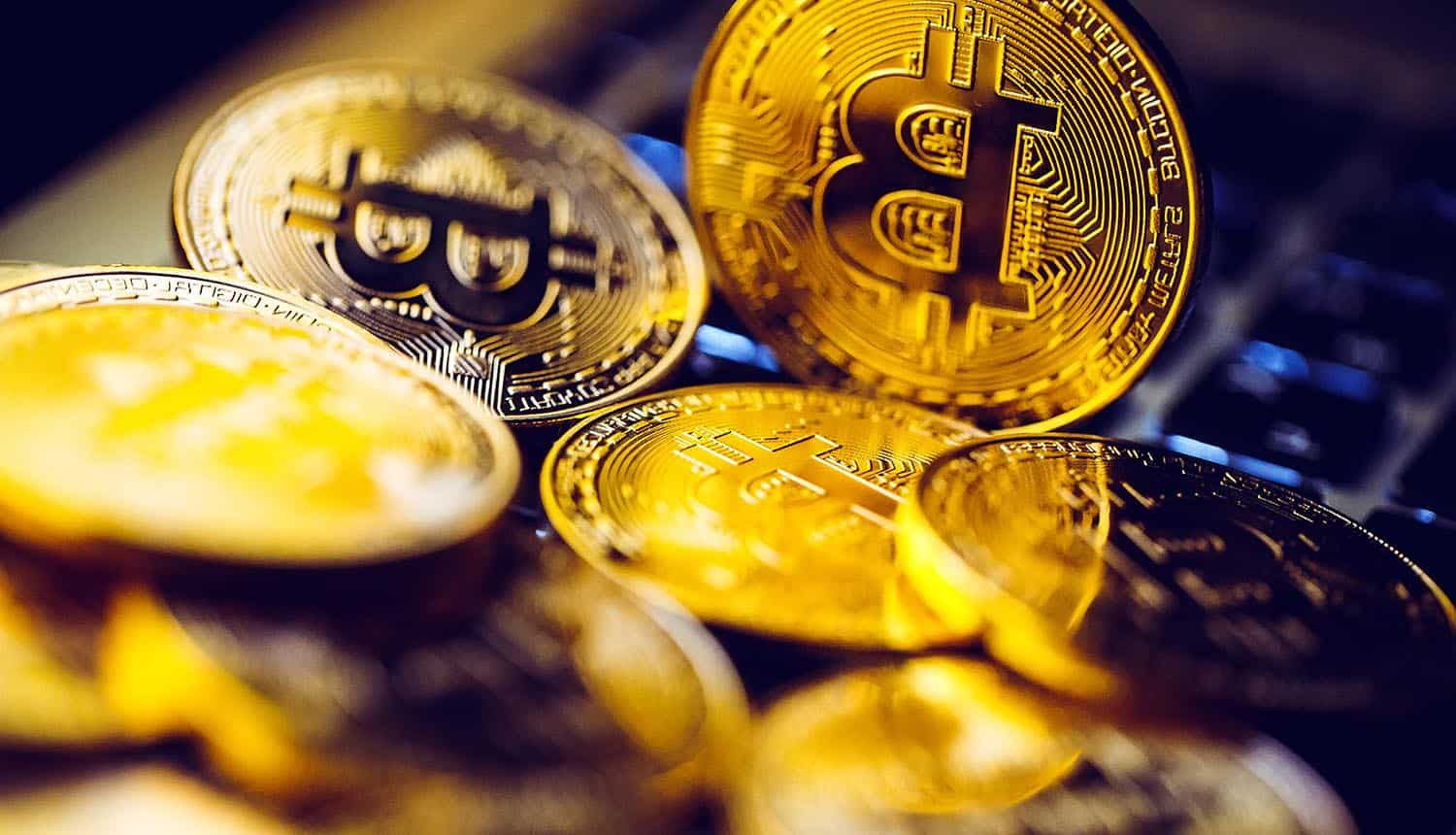Bitcoin coins on laptop keyboard