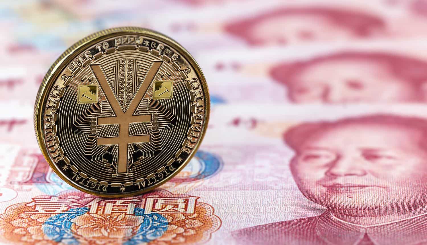 e-RMB gold coin over 100 yuan banknotes