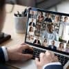 Businessman talking to team of colleagues on online video conference showing Zoom AI data collection