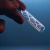 DNA molecule in glass tube in hand of scientist showing credential stuffing attack result in data theft