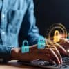 Man typing on laptop with lock icons showing state government MOVEit data breach