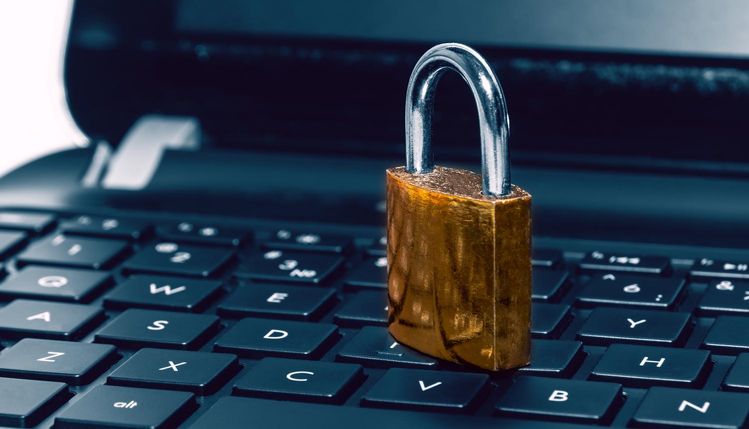 Padlock on computer laptop keyboard