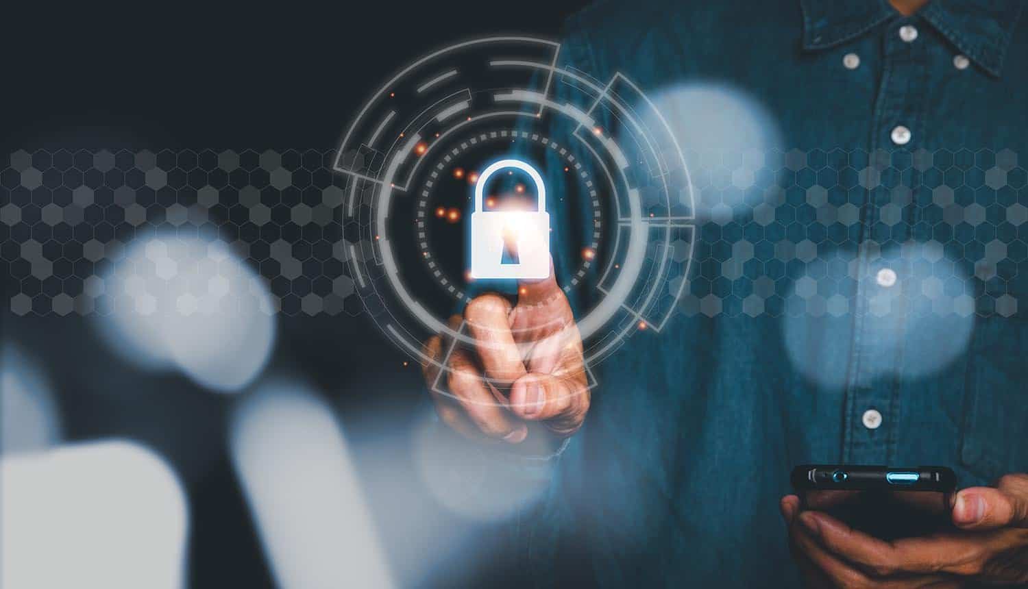 Man using smart phone and finger touching security glowing sign