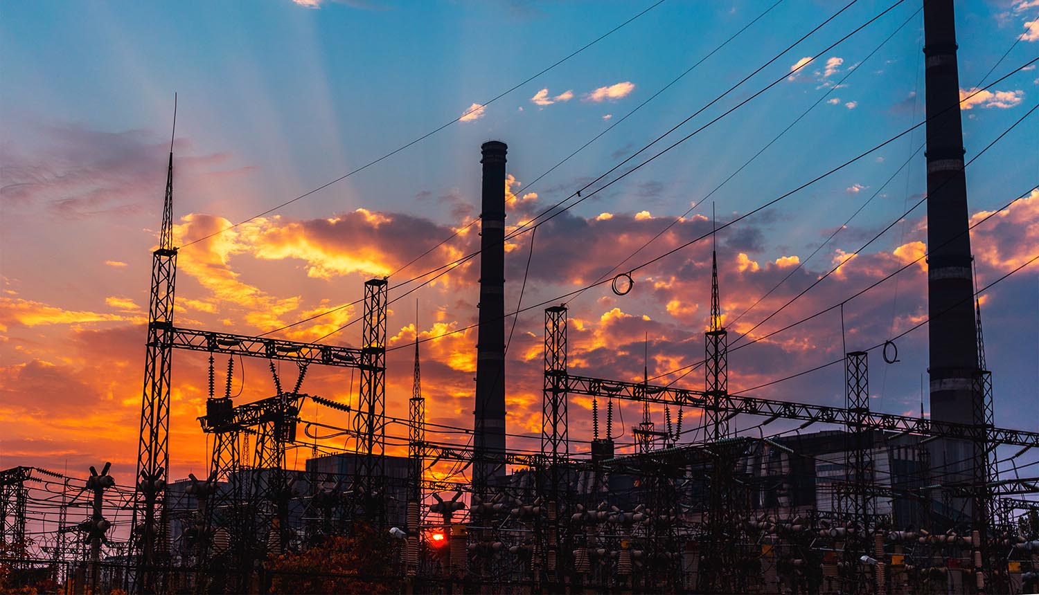 Smoke stacks at power plant showing Chinese hackers and critical infrastructure