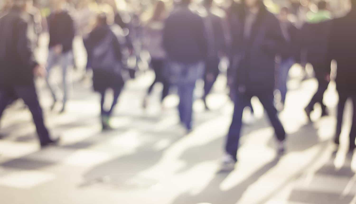 Pedestrians on street showing data breach at French unemployment agency