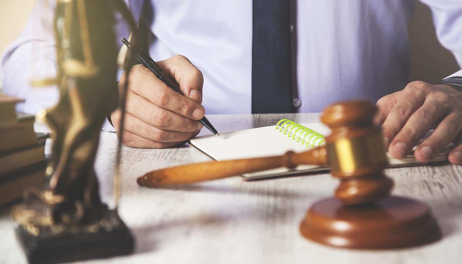 Man with hammer on the desk