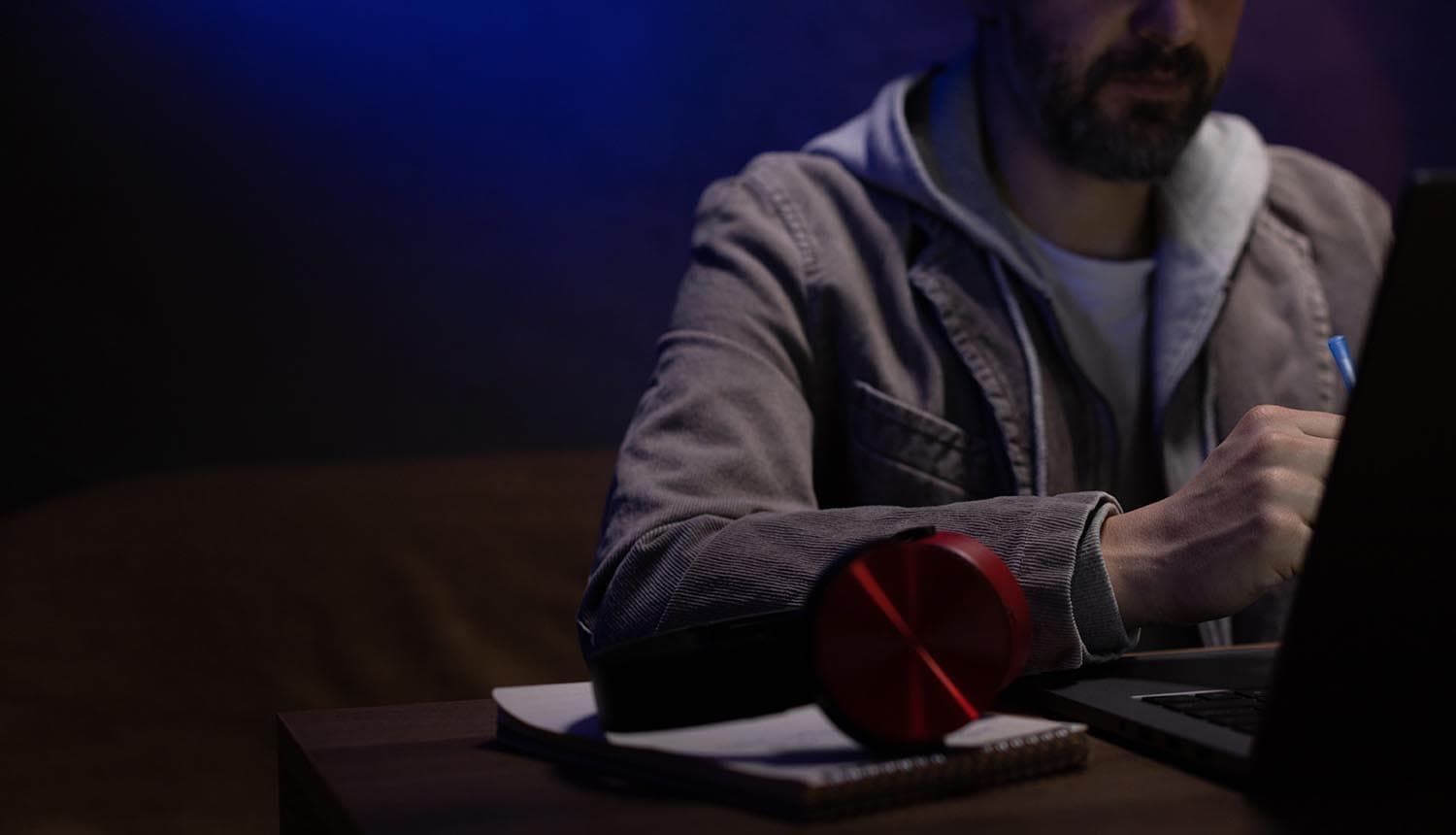 Hacker working on computer showing data breach exposed customer records