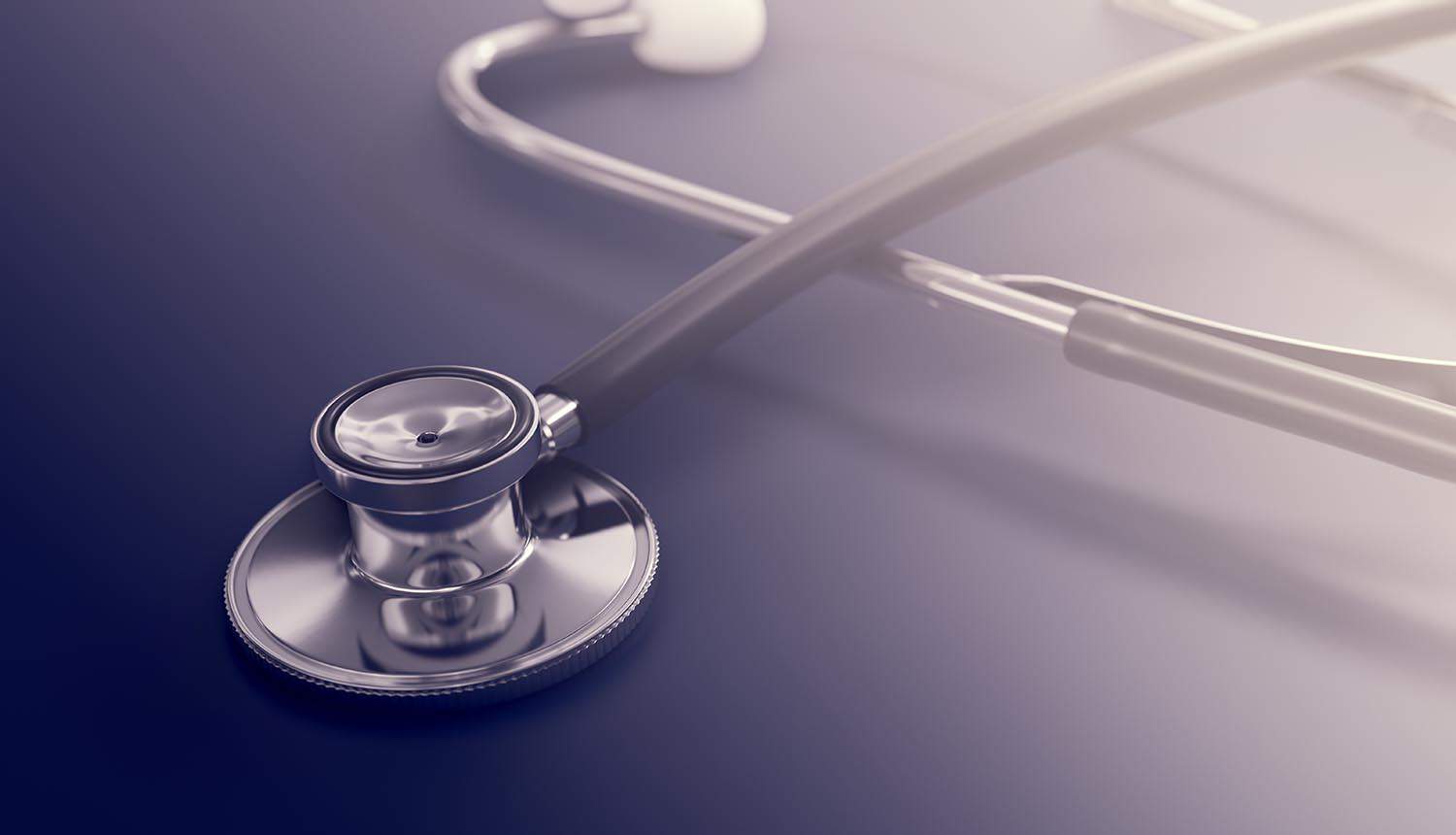 Stethoscope on table showing health insurance data breach