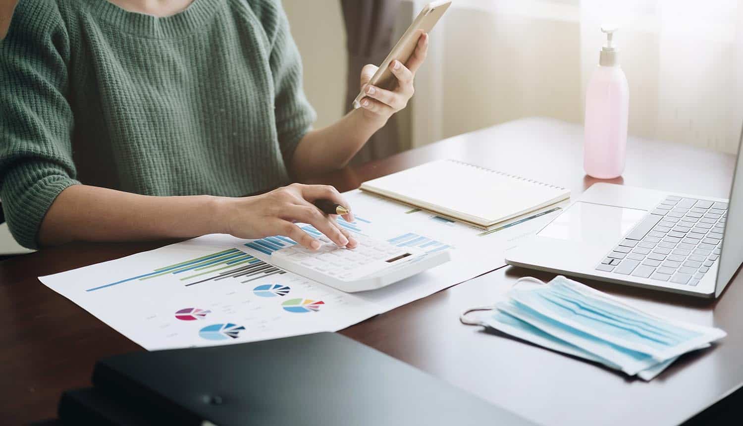 Woman working with calculator