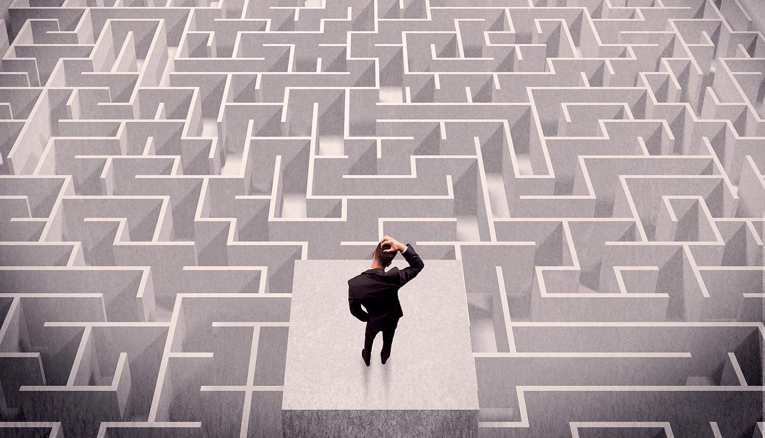 Man thinking while standing on a square platform