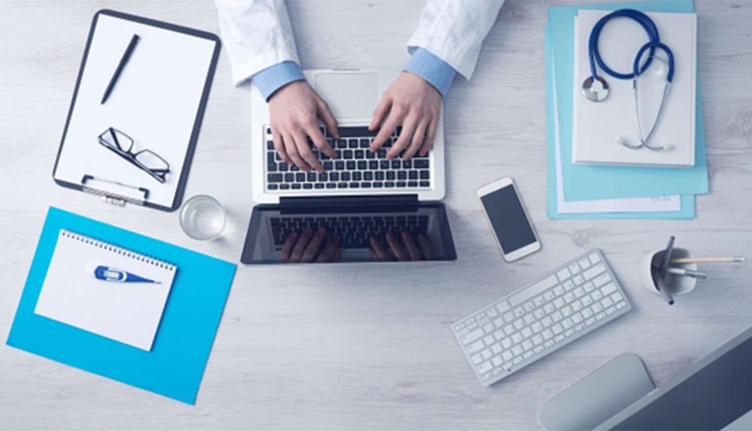 Doctor typing on keyboard