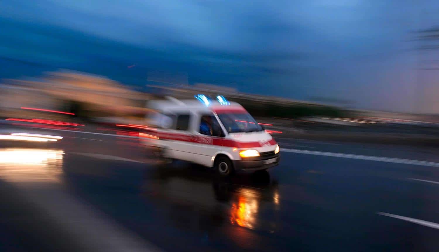 Ambulance speeding blurred motion showing cyber attack of ambulance services