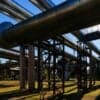 Steel pipelines outgoing from oil plant showing cyber attack