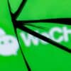 WeChat messenger in mirror showing privacy complaints of Chinese apps data transfer