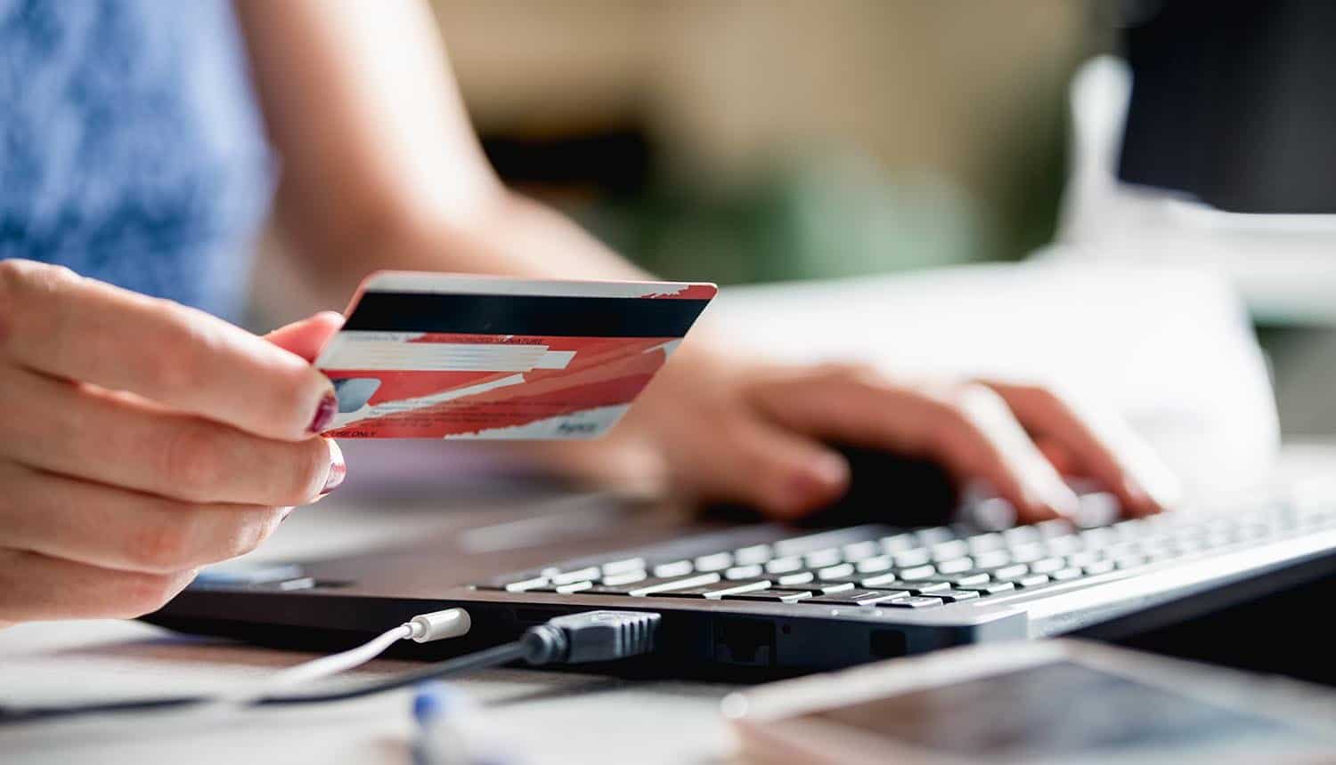 Woman online shopping, showing credit card data breach