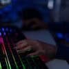 Close-up of hacker hands at keyboard showing cyber attack