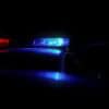 Patrol car with flashing lights showing arrests of cybercrime hacking forum