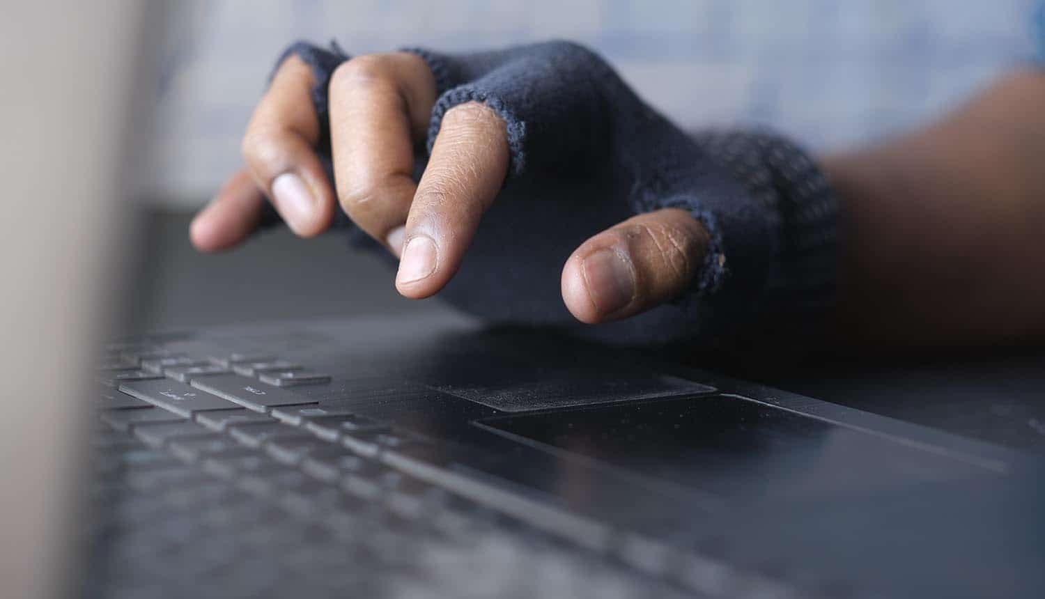 Hand on keyboard showing data breach at insurance company