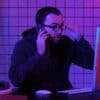 Hacker talking on phone showing third-party data breach