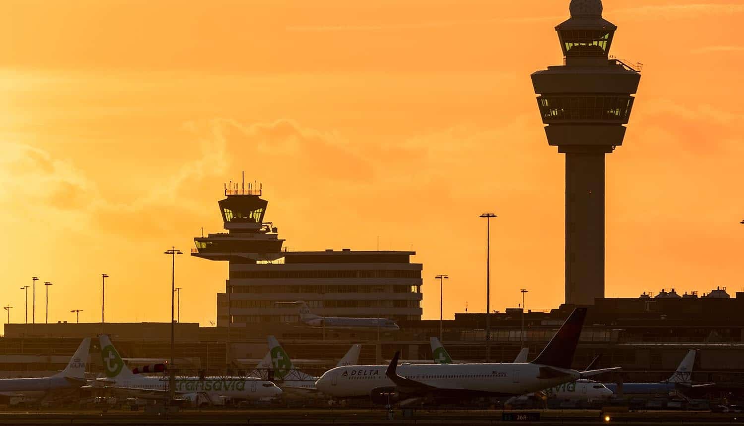 Airport with planes at the gates showing cyber attack impact on European airports