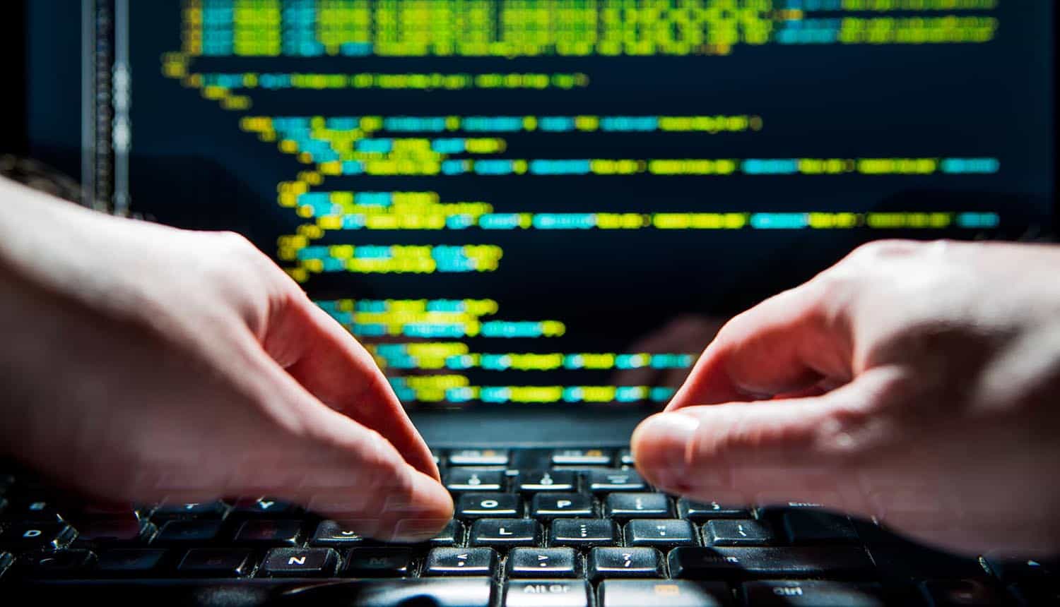 Hacking typing on keyboard showing third-party data breach