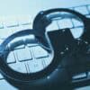 Handcuffs on keyboard showing malware networks and cybercrime