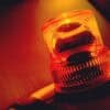 Orange flashing and rotating light showing cyber attack on emergency alert services