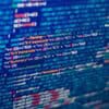Source code on monitor showing data breach of development server