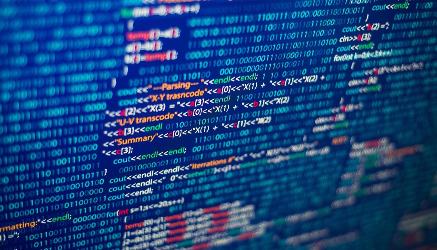 Source code on monitor showing data breach of development server