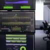 Analytics screens in office showing AI and telemetry