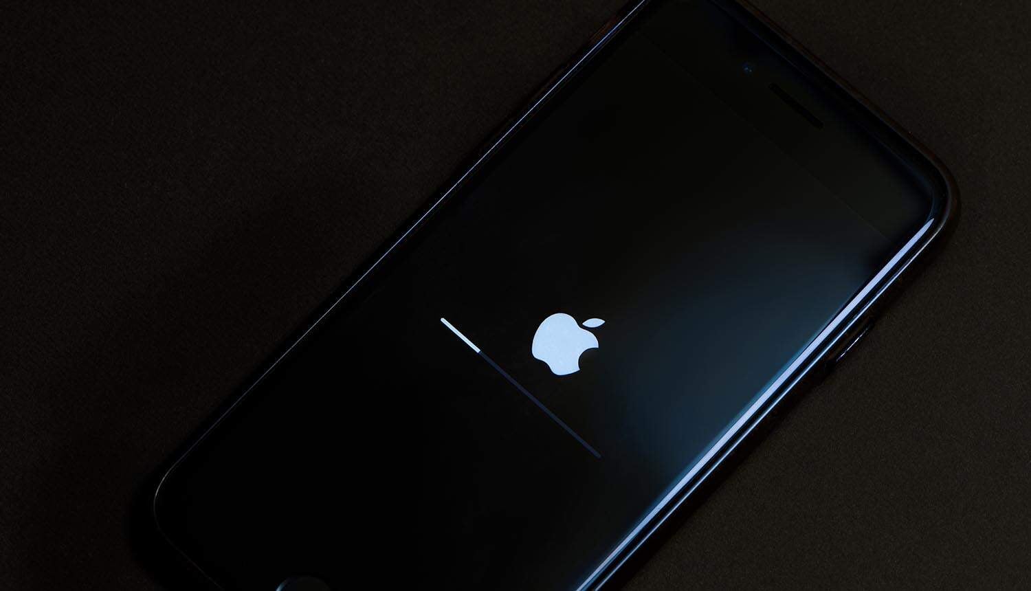 iPhone being updated showing zero-day vulnerability