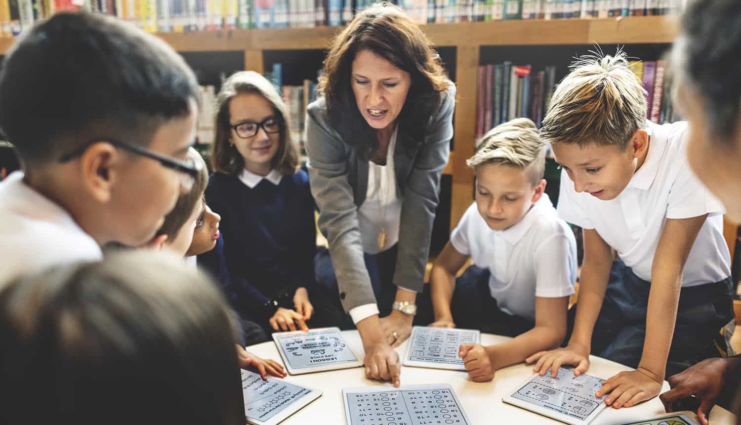 School teacher teaching students showing data privacy