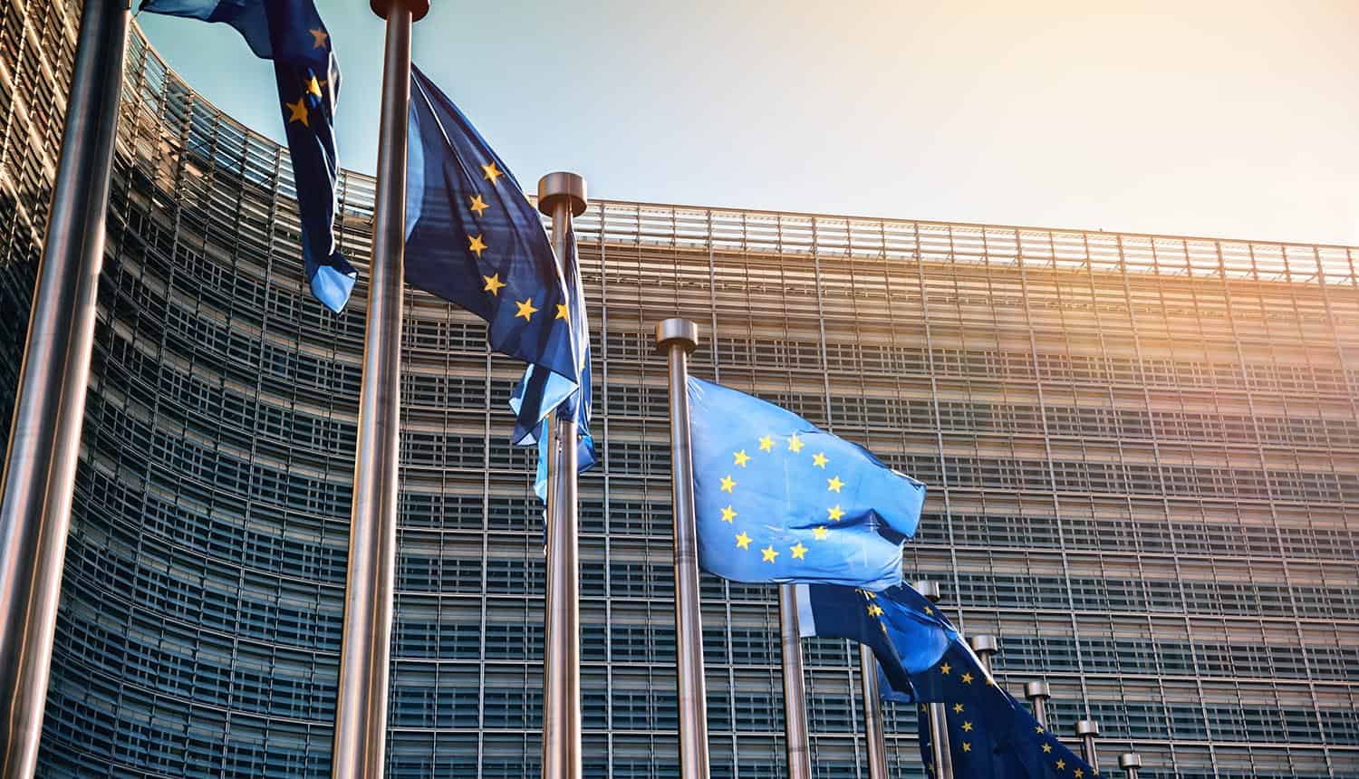 EU flags waving in front of European Commission building showing data breach