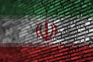 Iran flag with program code showing cyber attack by Iranian hackers