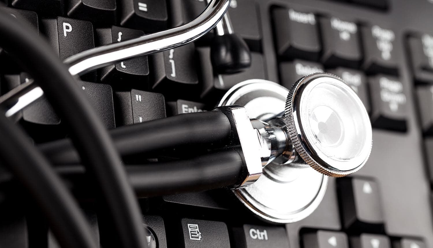 Stethoscope on top of computer showing healthcare data breach