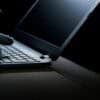 Hacker hands on laptop showing data breach
