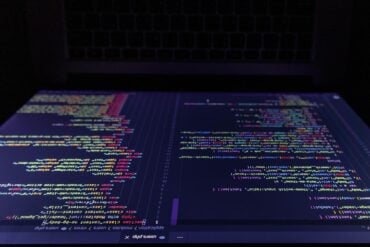 Screen of the laptop showing source code leak of AI agent