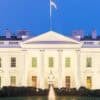 White House at twilight showing operating budget cuts for CISA