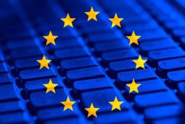 EU flag and computer keyboard showing AI security risk and Euro banks