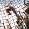 Military soldiers climbing rope showing location data