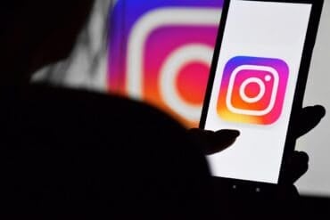 Phone with Instagram screen showing AI support chatbot