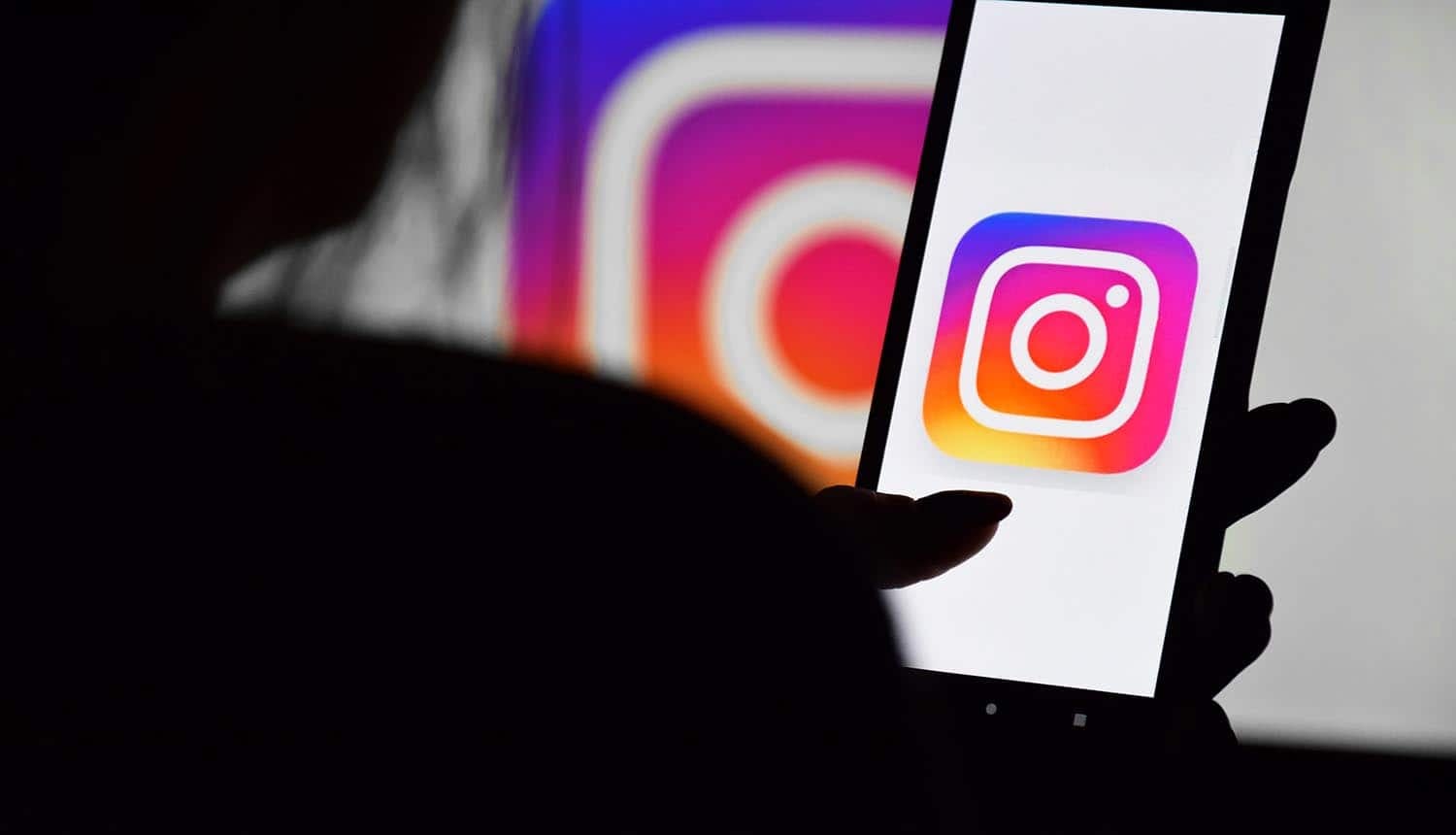 Phone with Instagram screen showing AI support chatbot