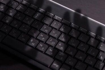 Shadow of hand on keyboard showing Copilot vulnerability and data theft