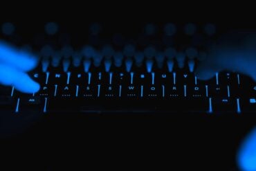 Hacker hands typing showing security breach