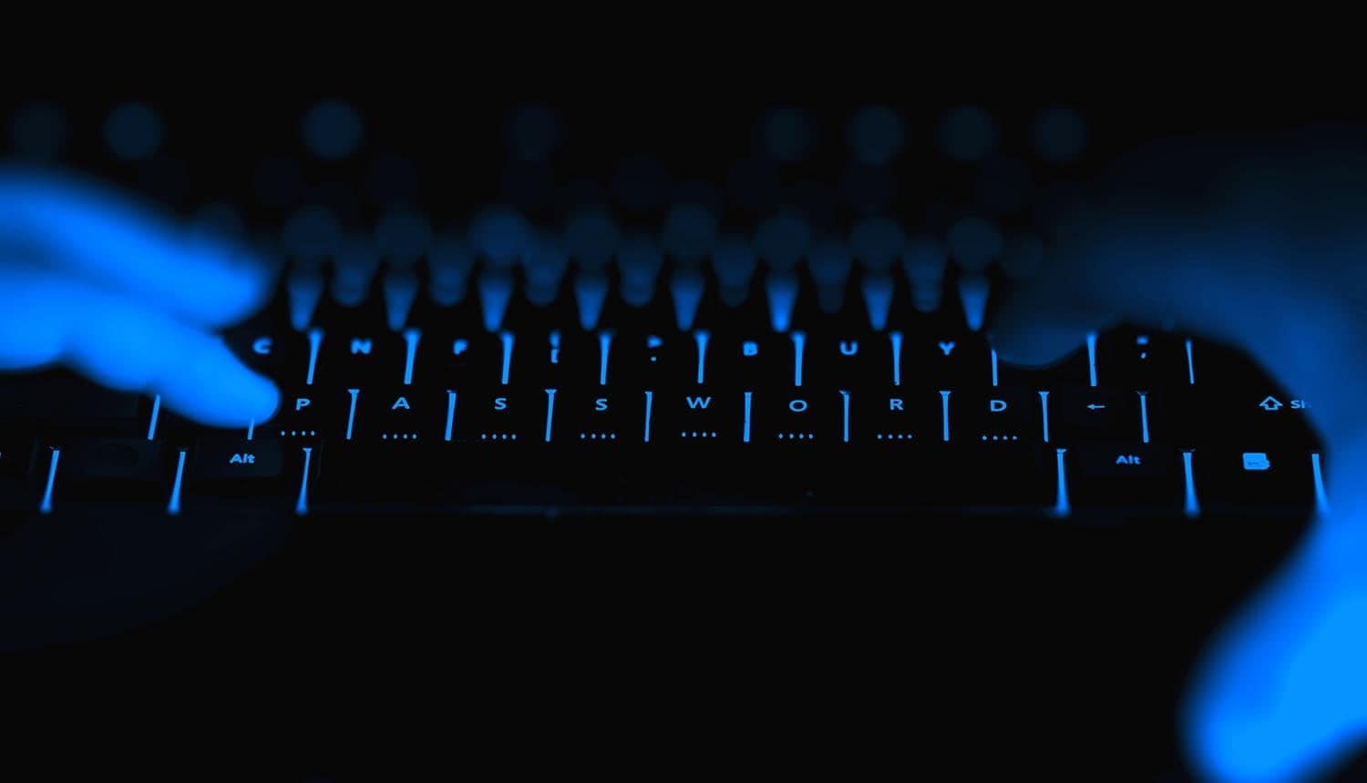 Hacker hands typing showing security breach