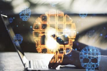 Hands on laptop showing data breach