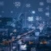City skyline with email system showing data breach