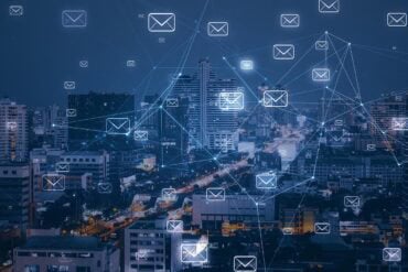 City skyline with email system showing data breach