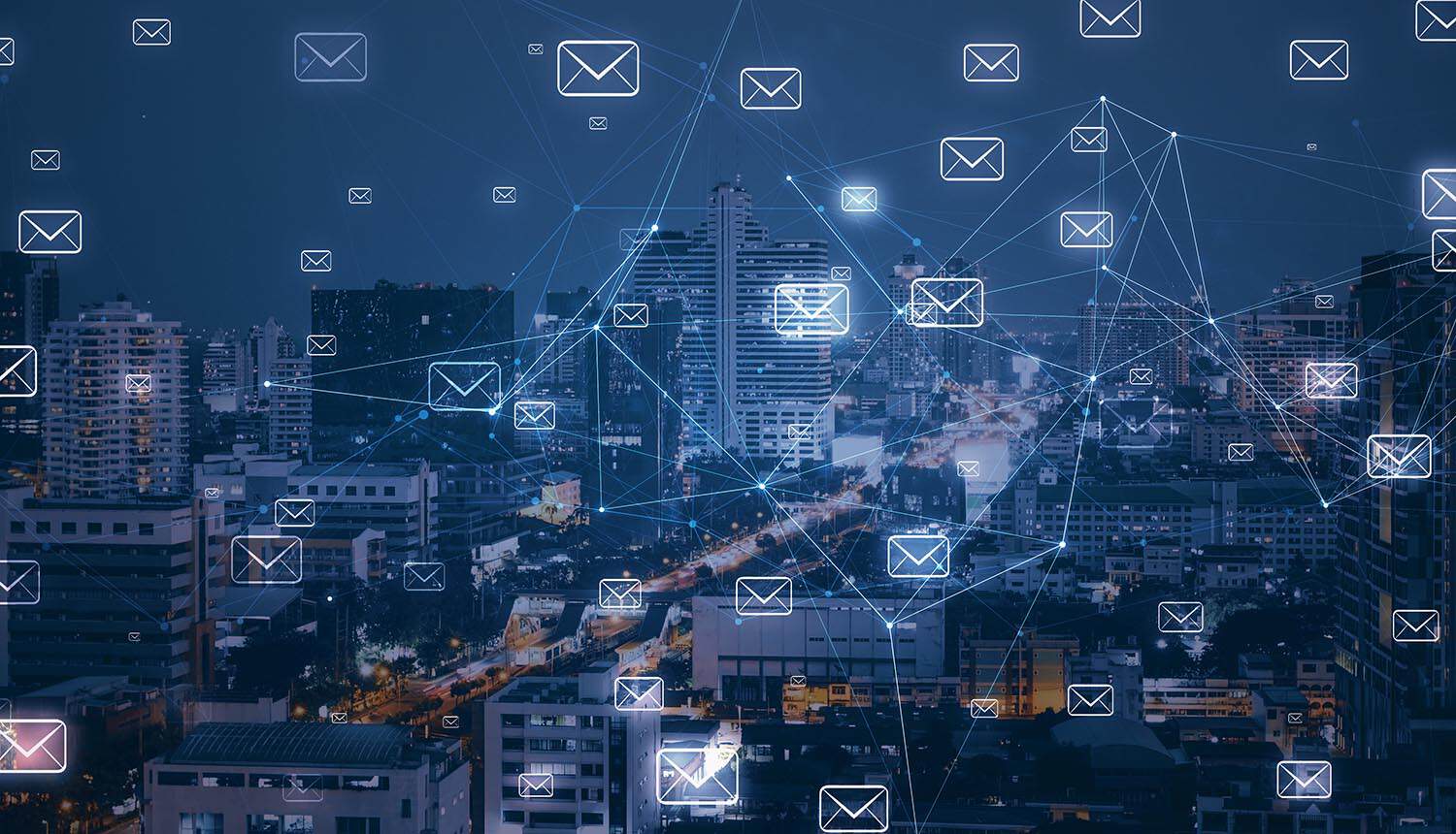 City skyline with email system showing data breach