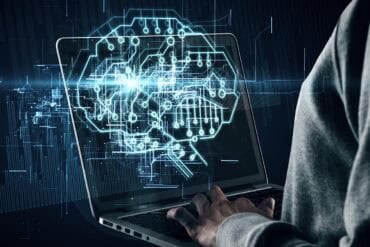 Hands using laptop with brain hologram showing shadow AI and data governance